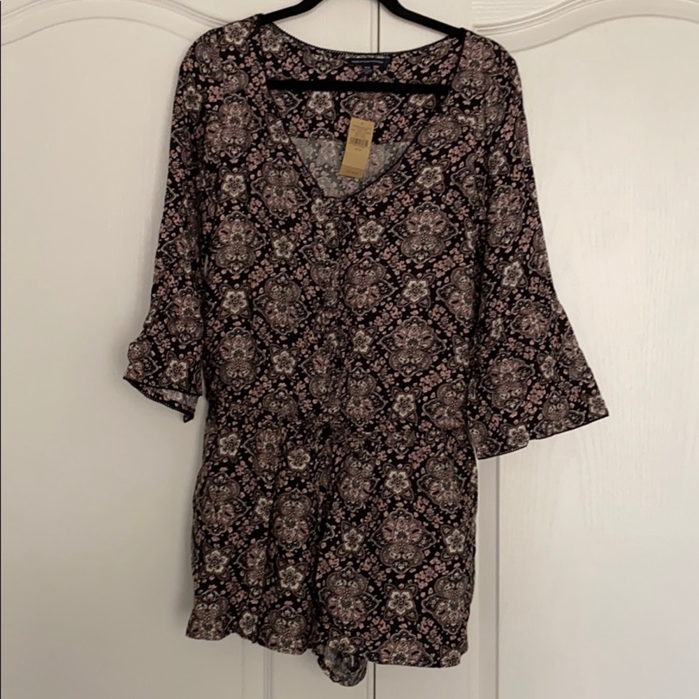 Bell-sleeved romper.